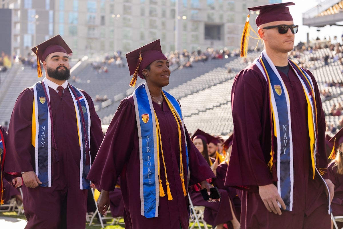  Veterans walk in a processional during undergraduate commencement at Mountain America Stadium in Tempe on Dec. 16, 2024.