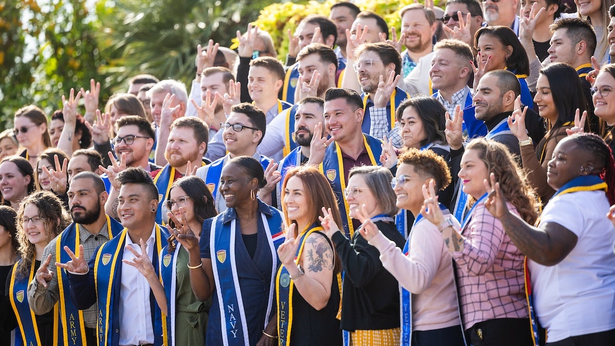 Student veterans pose for a photo after the Veterans Honor Stole Ceremony, Dec. 12, 2024.