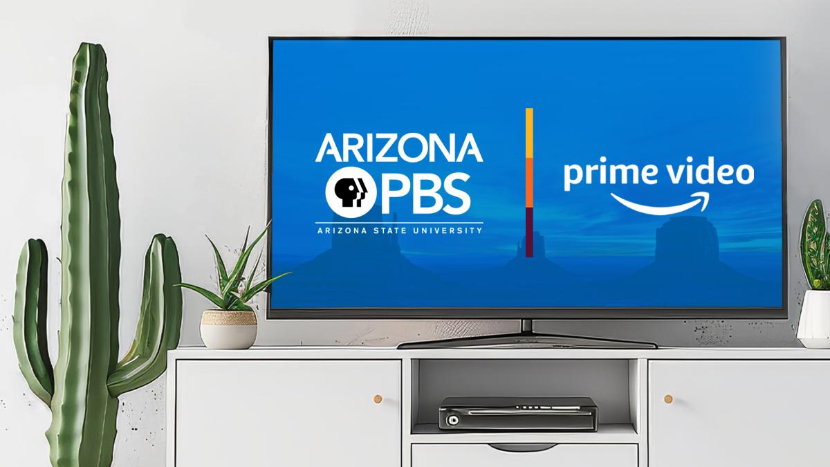 A large, flat screen TV with the Arizona PBS and Prime Video logos displayed on it sits on a white TV cabinet