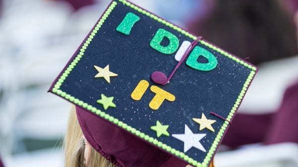 Closeup of graduation cap decorated with the phrase: I did it.
