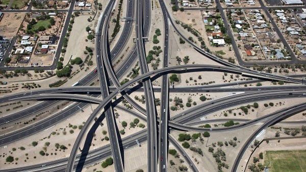 Aerial view of a portion of highways that intersect and overlap.