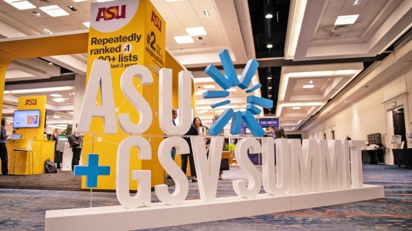 Large ASU+GSV Summit sign on the floor of an expo