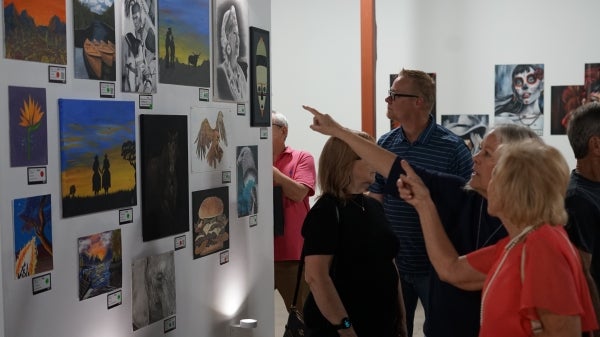 People gathered in an art gallery